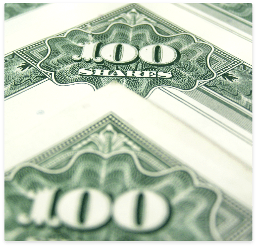 certificate shares stocked on top of each other